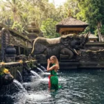 Devotees performing the traditional Melukat water purification cleansing ritual at Tirta Empul Temple Bali