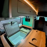 Campervan East Bali diparkir di tengah lanskap hijau Karangasem dengan gunung di kejauhan